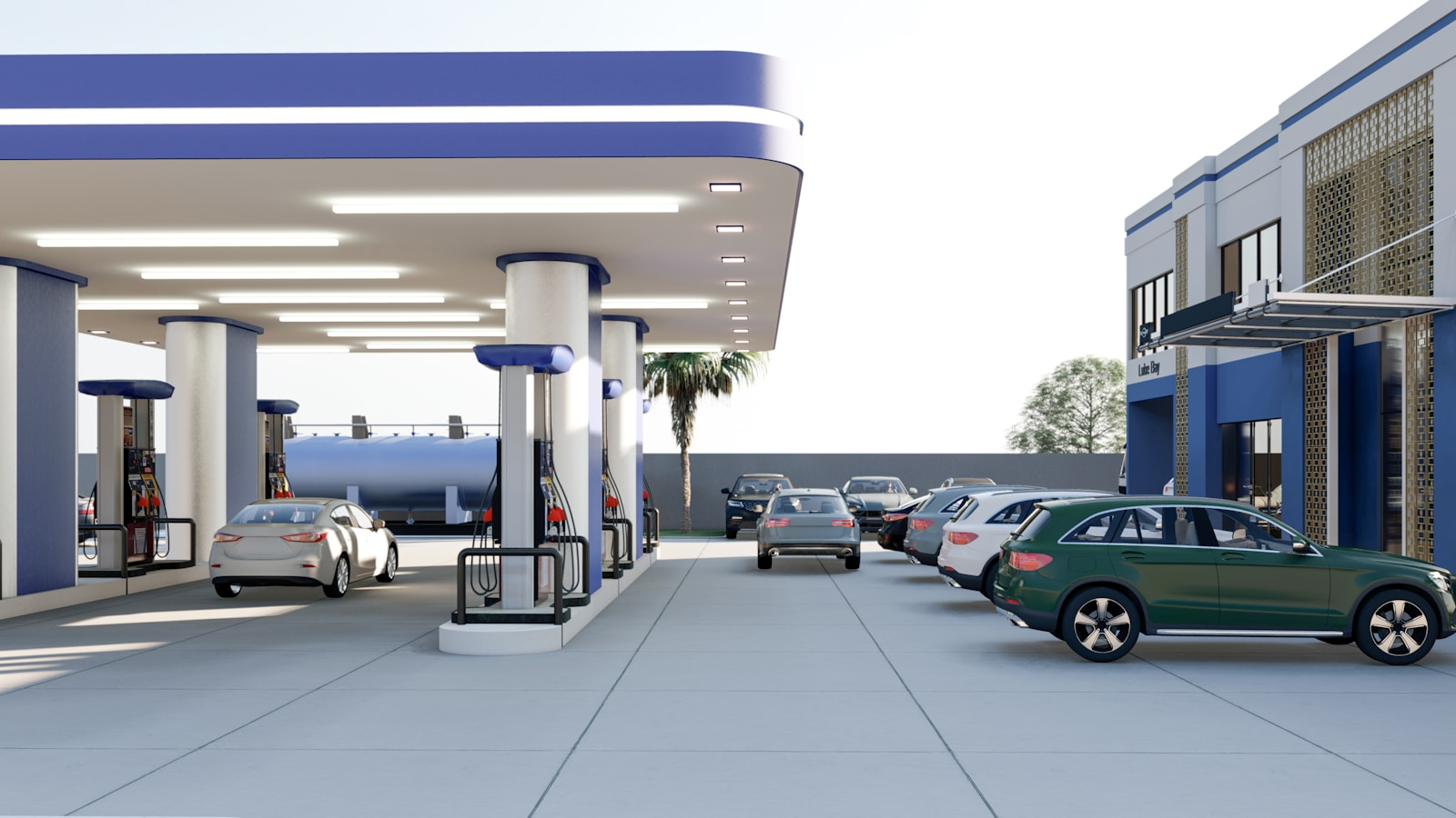 Photo by Ferdinand Asakome a green car is parked at a gas station